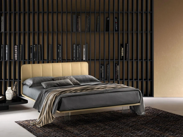 Leather bed with quilted headboard and transparent Clever legs by Bside.