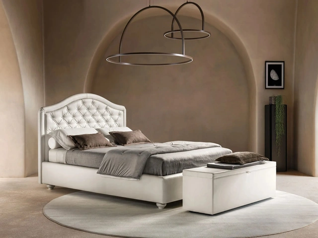 Bed in faux leather with shaped and quilted headboard Infinity by Bside.