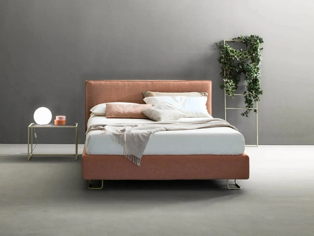 Modern fabric bed with Bside Piping headboard.