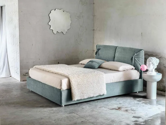 Jackie upholstered bed by Veneran.