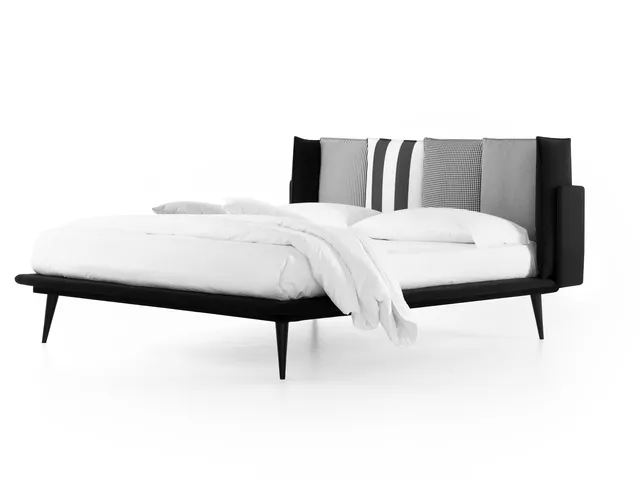 Bed with Birdland headboard by Noctis.