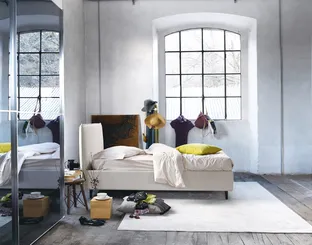 Minimal design bed in fabric with Bob headboard by Noctis.