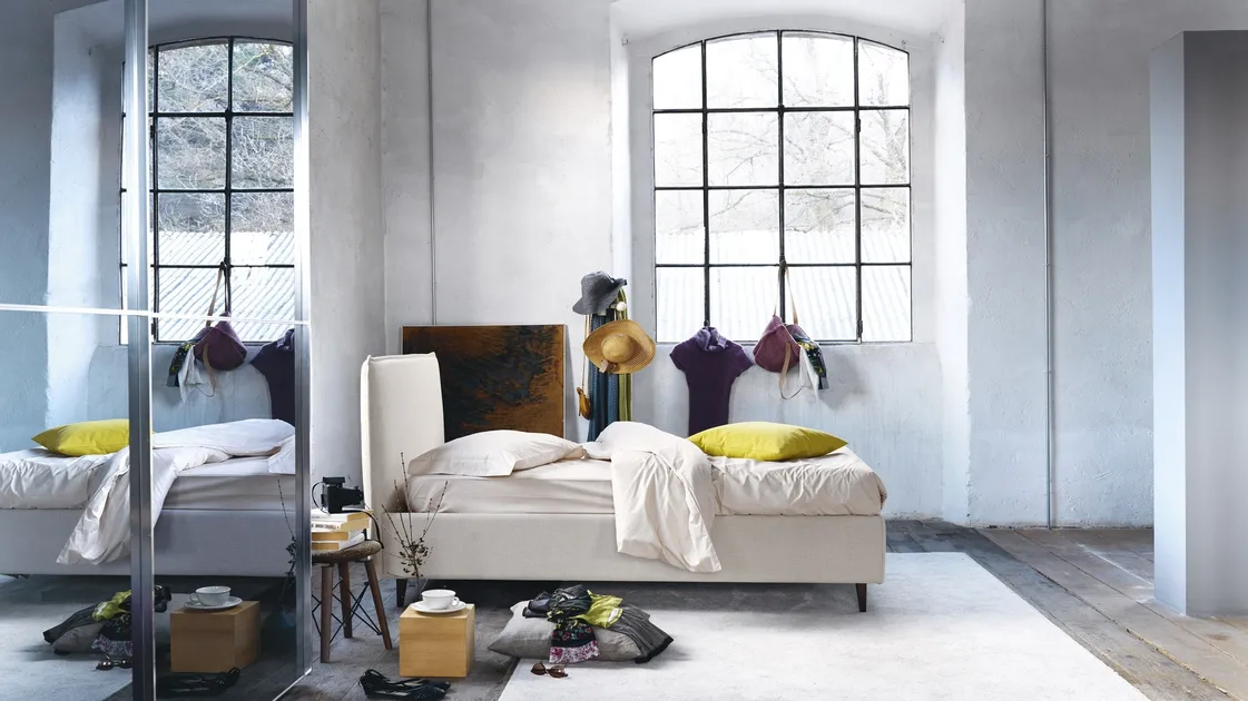 Minimal design bed in fabric with Bob headboard by Noctis.