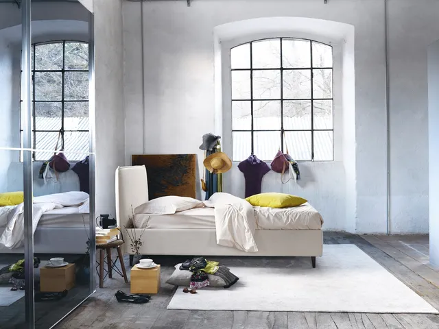 Minimal design bed in fabric with Bob headboard by Noctis.