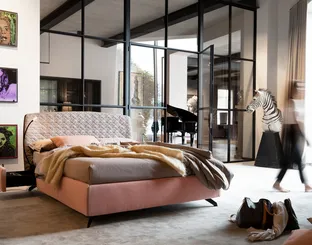 Bed Bed with rounded and quilted headboard by Noctis.
