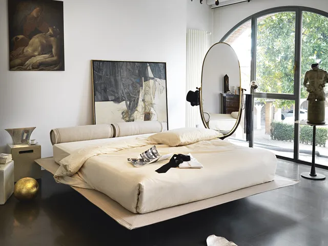 Bed with rolled headboard and rear feet so that they are invisible Flamingo by Noctis