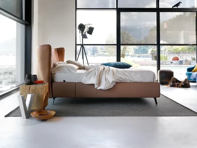 Faux leather bed with curved headboard Leonte by Noctis