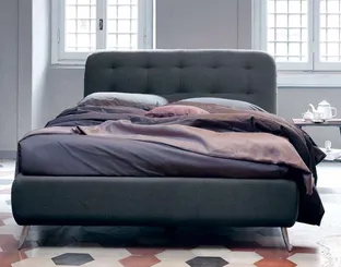 Upholstered fabric bed with Paco headboard by Noctis.