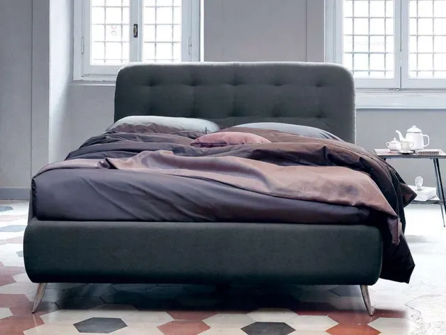 Upholstered fabric bed with Paco headboard by Noctis.