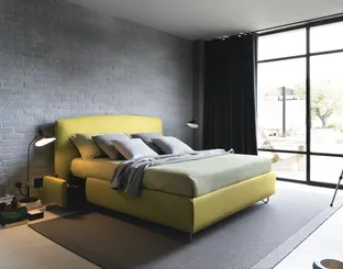 Upholstered fabric bed with storage Sula by Noctis.