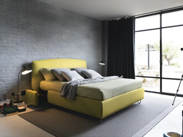Upholstered fabric bed with storage Sula by Noctis.