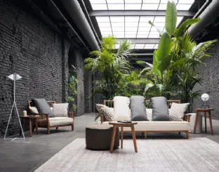 Gray armchair in walnut by Gervasoni.