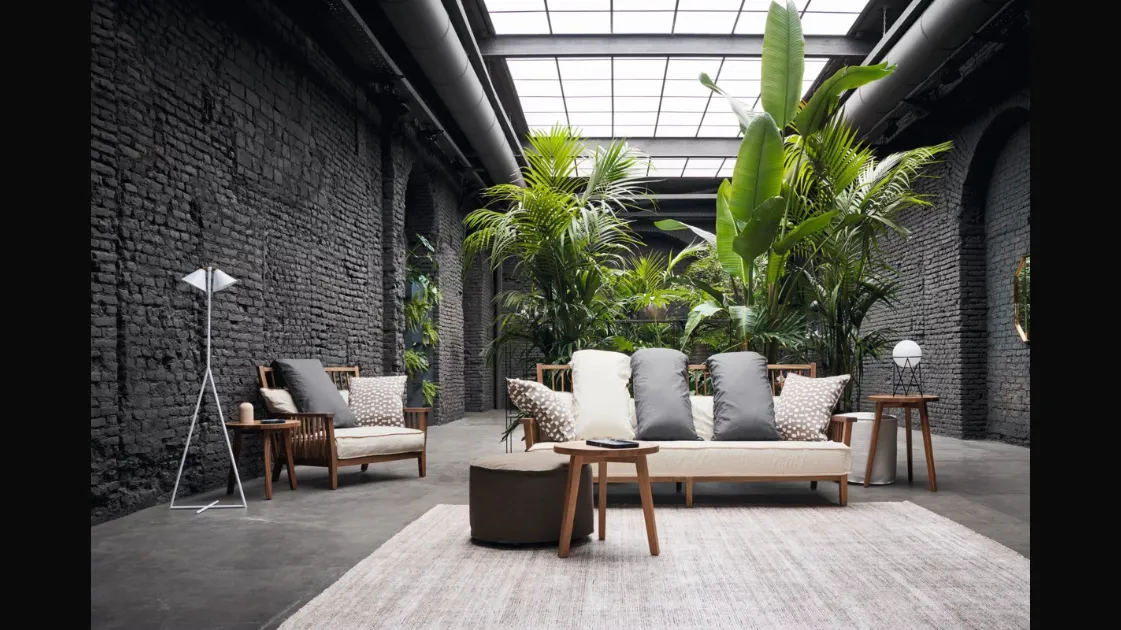 Gray armchair in walnut by Gervasoni.