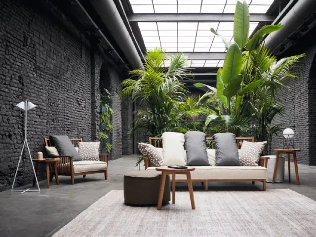 Gray armchair in walnut by Gervasoni.