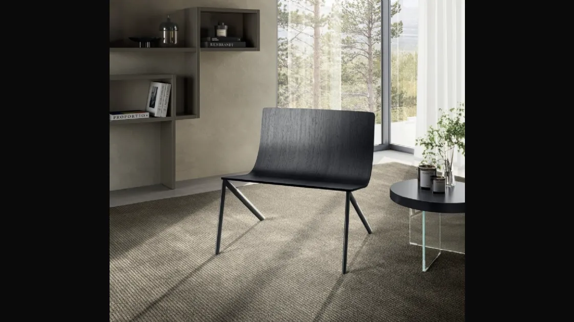 Half-air armchair in wood by Lago.