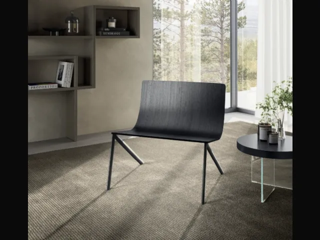 Half-air armchair in wood by Lago.