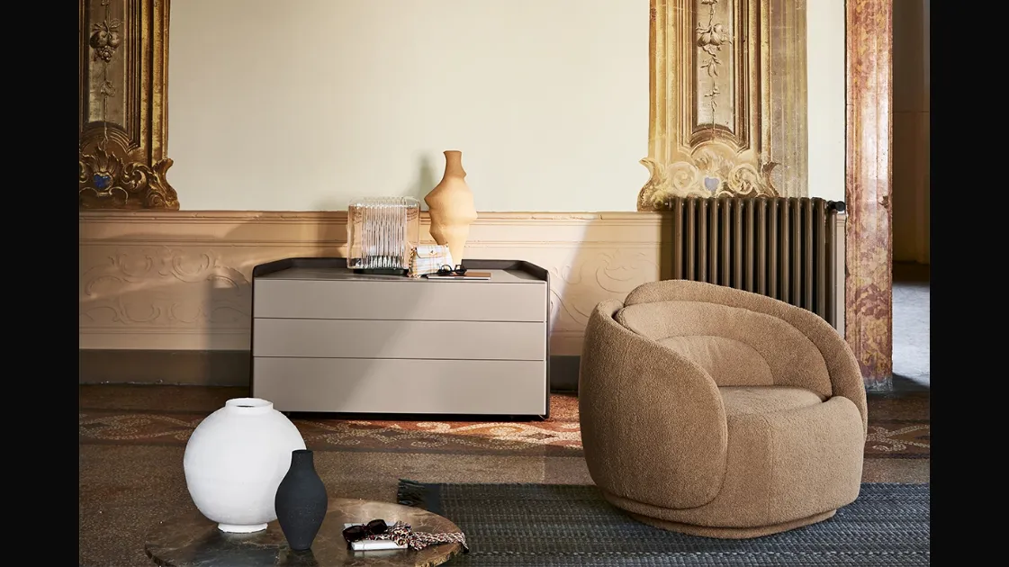 Peony armchair upholstered in fabric by Pianca.