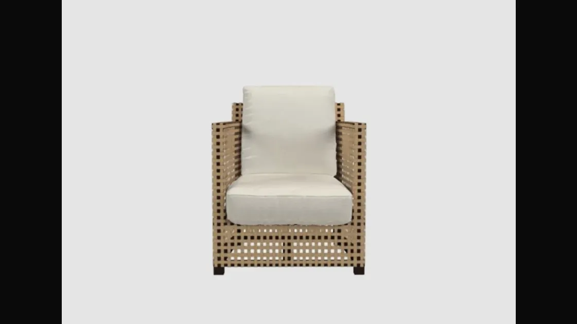 Perforated leather and fabric lounge chair WK by Gervasoni.