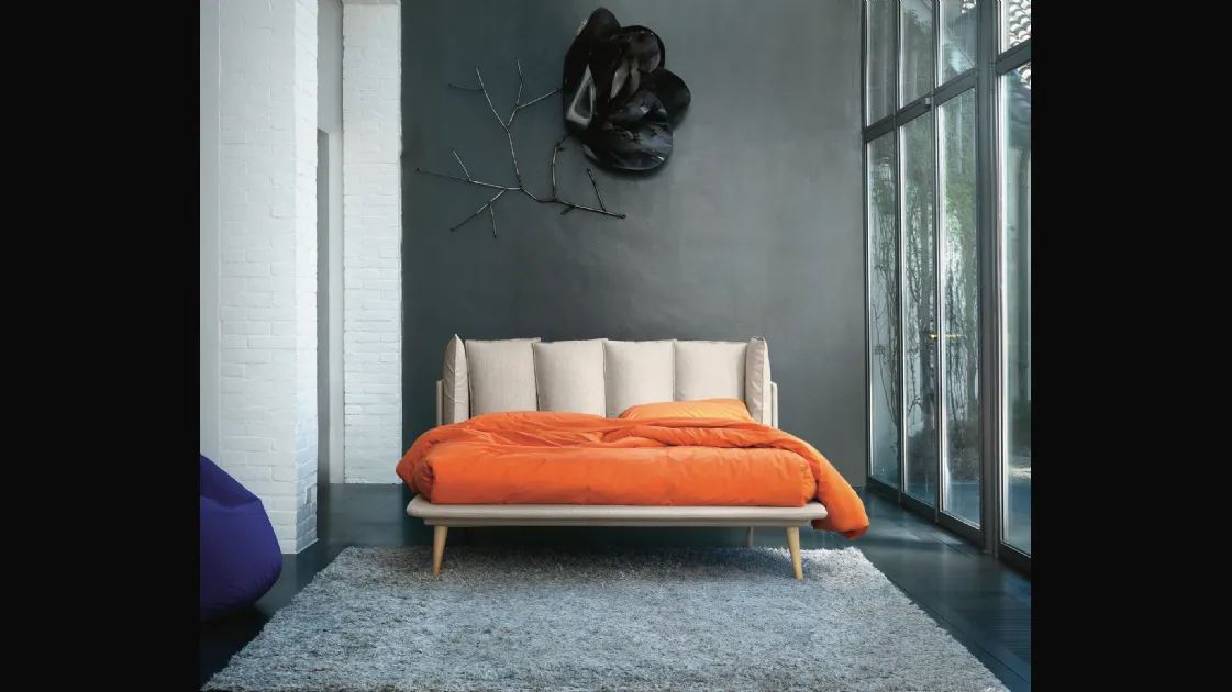 Bed with Birdland headboard by Noctis.