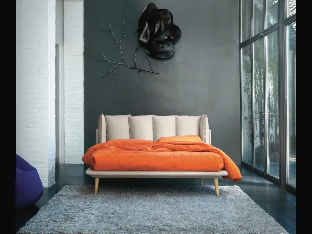 Bed with Birdland headboard by Noctis.