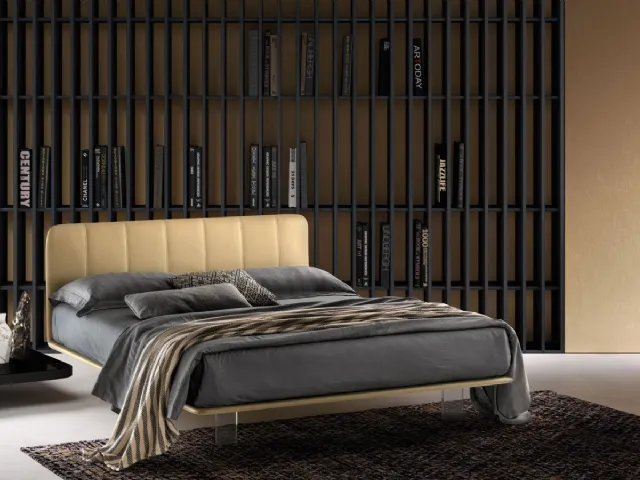 Leather bed with quilted headboard and transparent Clever legs by Bside.