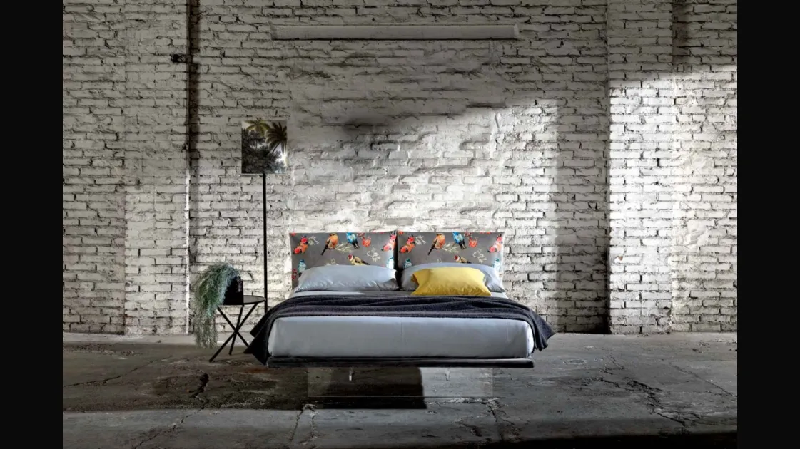 Double bed in fabric with a plexiglass base that makes it appear suspended like the Veneran Wire.