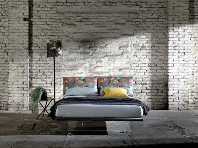 Double bed in fabric with a plexiglass base that makes it appear suspended like the Veneran Wire.