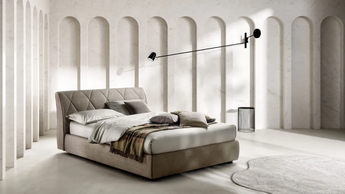 Upholstered fabric bed with quilted Kilt headboard by Bside.