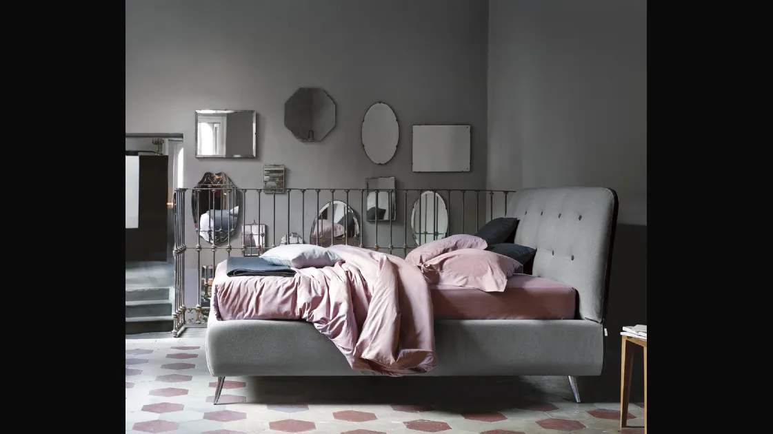 Upholstered fabric bed with Paco headboard by Noctis.