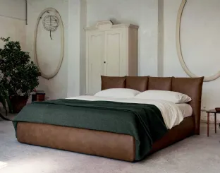 Vintage faux leather bed with a wraparound headboard and Plissé storage box by Veneran.