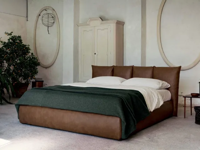 Vintage faux leather bed with a wraparound headboard and Plissé storage box by Veneran.