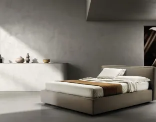 Bed upholstered in fabric with Relaxed headboard by Bside.