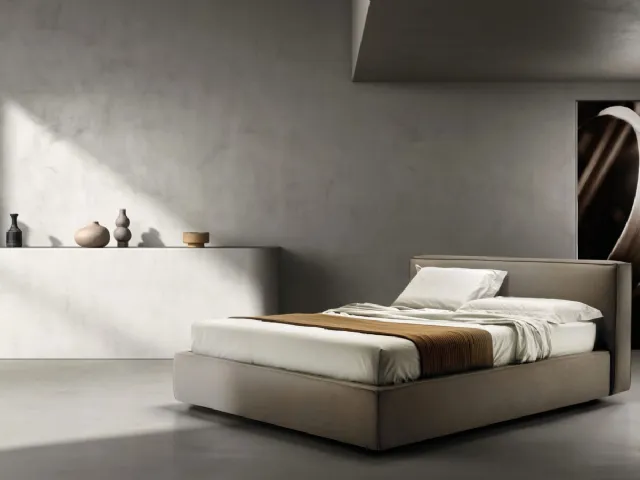 Bed upholstered in fabric with Relaxed headboard by Bside.