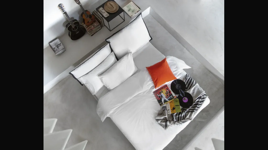 Modern bed with So Pop fabric headboard by Noctis.