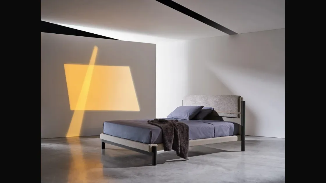 Read in Gervasoni's Strap fabric bed.