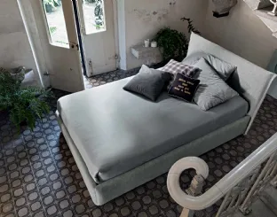 Upholstered fabric bed with Twin Line headboard by Veneran.