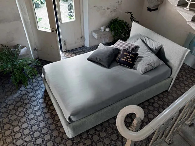 Upholstered fabric bed with Twin Line headboard by Veneran.