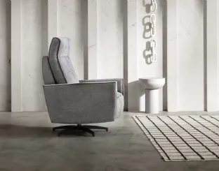 Gaspy Relax fabric armchair with footrest by Samoa, reclining.