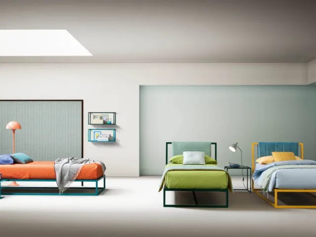 Single bed with painted metal structure and upholstered fabric headboard Frame by Bside.