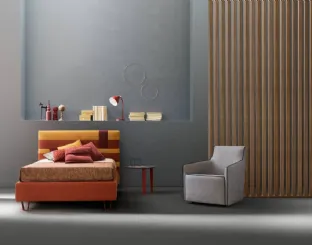 Bed with upholstered headboard in Bside fabric.