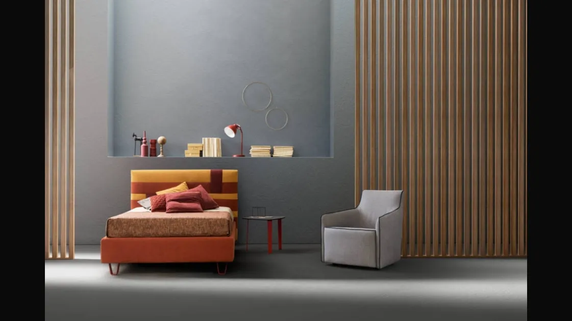 Bed with upholstered headboard in Bside fabric.