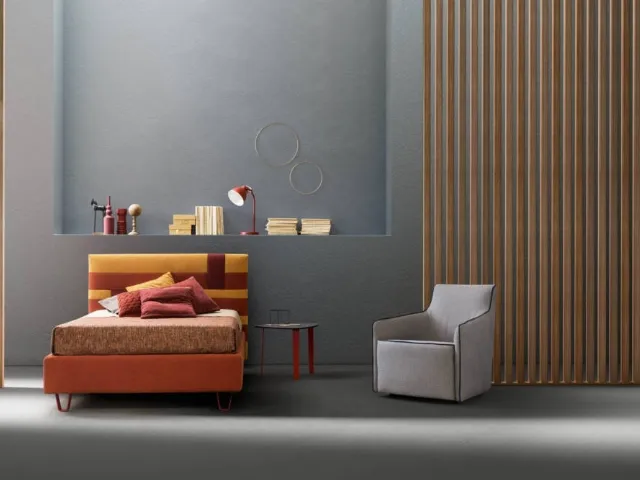 Bed with upholstered headboard in Bside fabric.