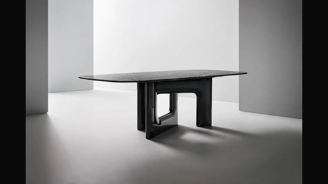 Liaison design table with marble top and polyurethane base by Bonaldo.