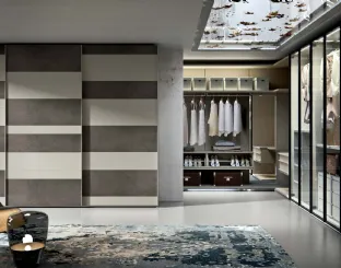 Wardrobe with Horizon sliding doors in matte lacquered cord and Veneran slate resin.