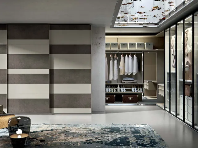 Wardrobe with Horizon sliding doors in matte lacquered cord and Veneran slate resin.