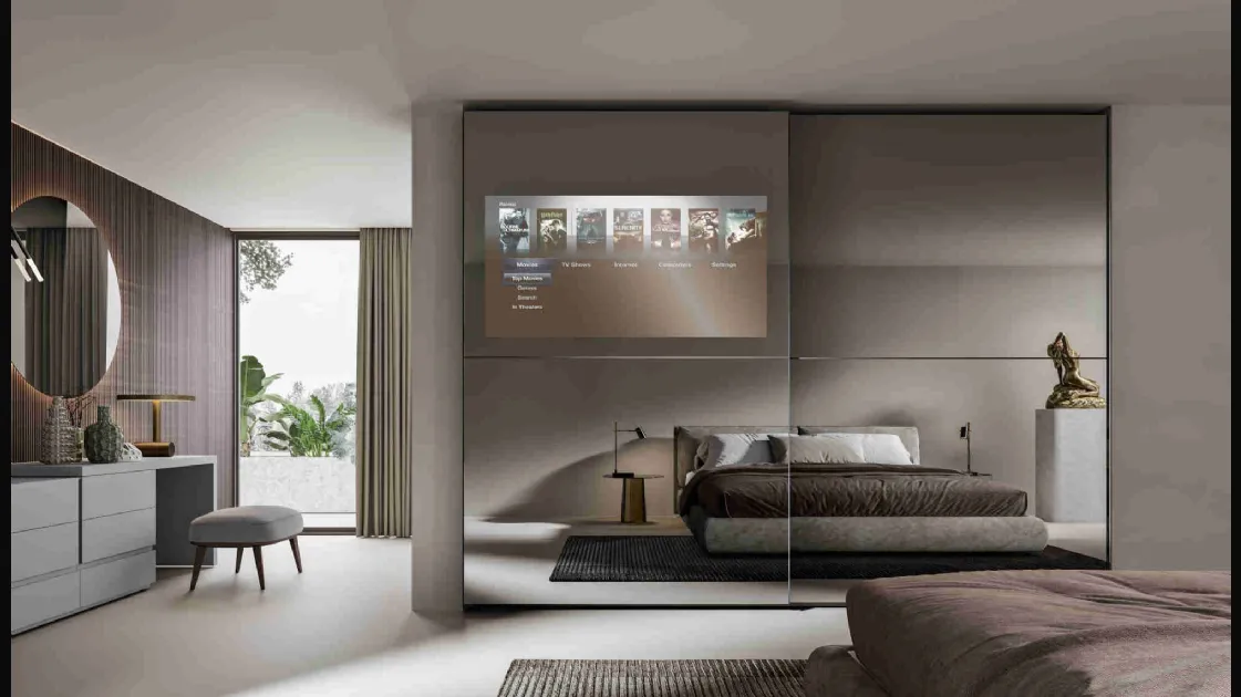 Visual wardrobe with sliding mirrored doors with TV by Veneran.