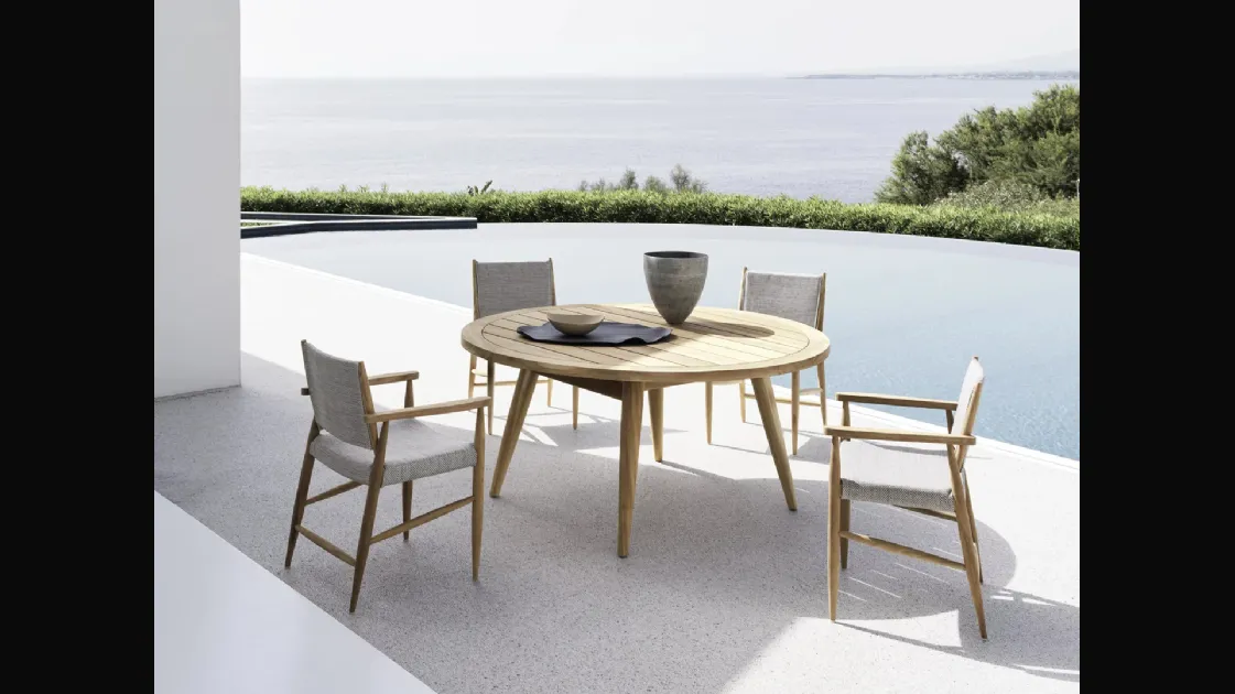 Round Eidos teak table by Gervasoni